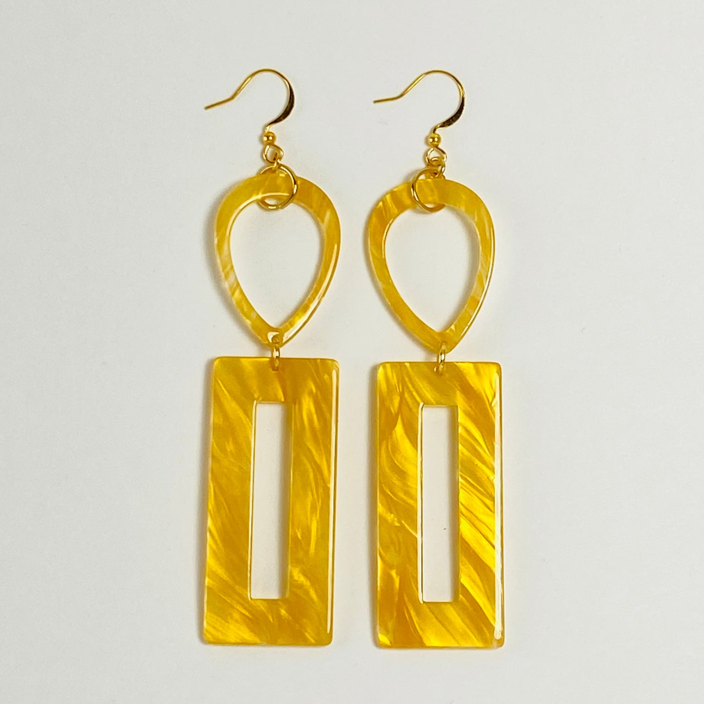 Dangling earrings with inverted teardrops and recatngle shaped donuts beads.