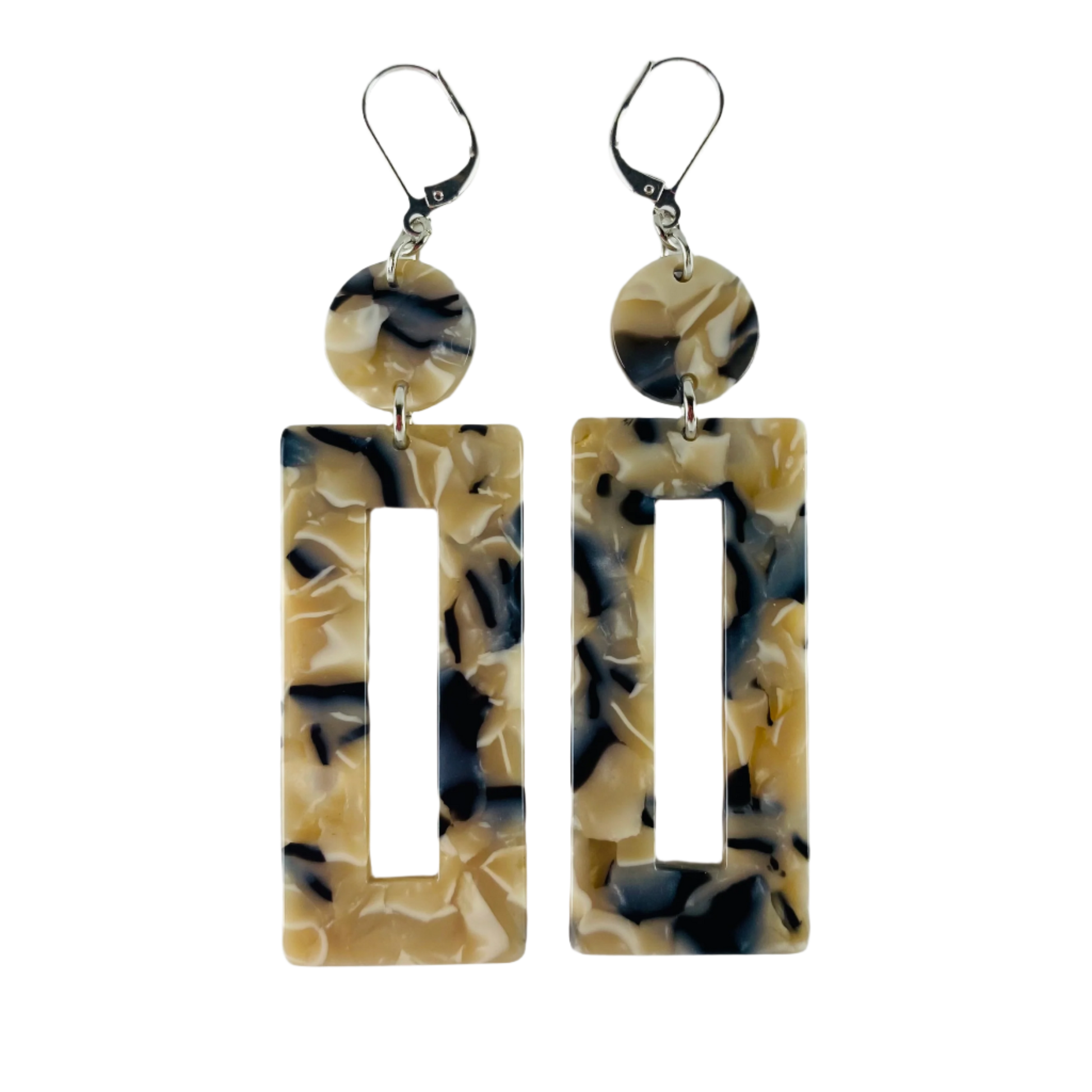 Dangling earring with two geometric shaped beads. One dime shaped and one donut shaped rectangle.  Marbled beige, midnight blue and white.